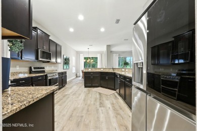 Embrace upscale, waterside living in this stunning two-story, 5