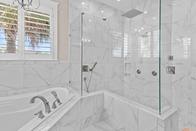 This canal-front home on Holiday Isle sits on a spacious corner