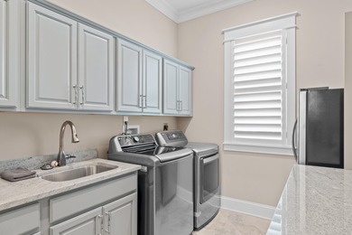 This canal-front home on Holiday Isle sits on a spacious corner