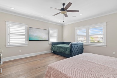 This canal-front home on Holiday Isle sits on a spacious corner