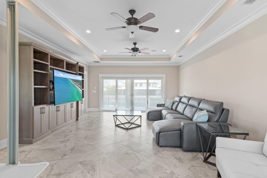 This canal-front home on Holiday Isle sits on a spacious corner