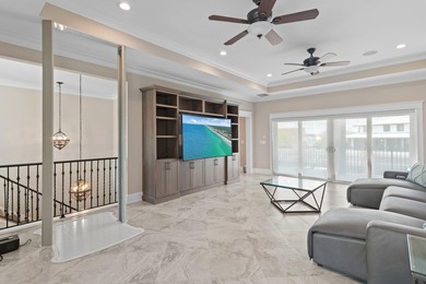 This canal-front home on Holiday Isle sits on a spacious corner