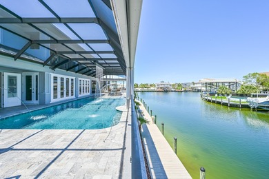 This canal-front home on Holiday Isle sits on a spacious corner