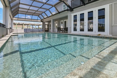 This canal-front home on Holiday Isle sits on a spacious corner