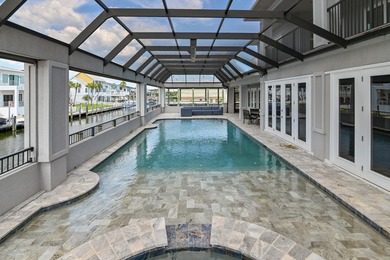 This canal-front home on Holiday Isle sits on a spacious corner