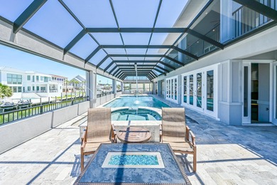 This canal-front home on Holiday Isle sits on a spacious corner