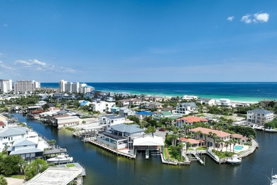 This canal-front home on Holiday Isle sits on a spacious corner