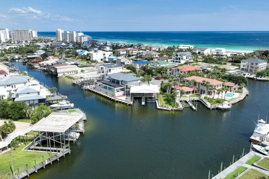 This canal-front home on Holiday Isle sits on a spacious corner