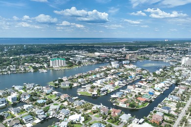 This canal-front home on Holiday Isle sits on a spacious corner