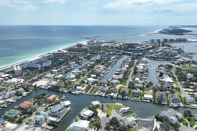 This canal-front home on Holiday Isle sits on a spacious corner