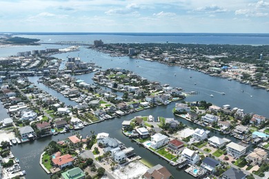 This canal-front home on Holiday Isle sits on a spacious corner