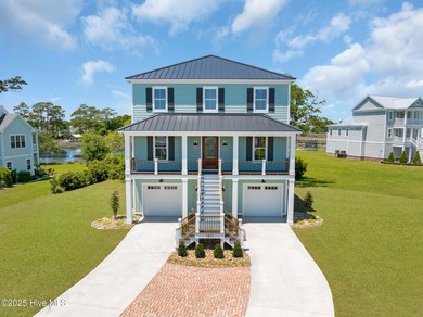 This exceptional new construction in Mariners Pointe blends