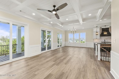 This exceptional new construction in Mariners Pointe blends