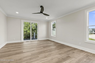 This exceptional new construction in Mariners Pointe blends