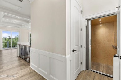 This exceptional new construction in Mariners Pointe blends