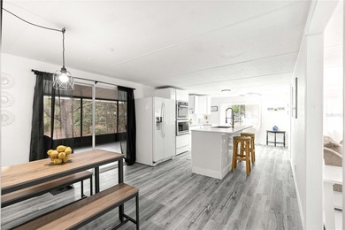 Fully furnished and completely updated, this turnkey home is