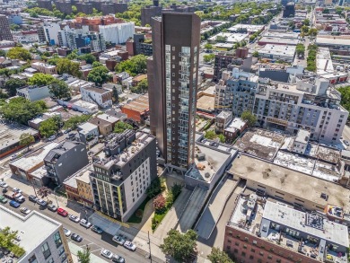 **Breathtaking East River Views from Luxury Astoria High-Rise**

