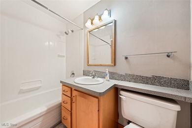 Welcome HOME where the Lake beckons from your window in this