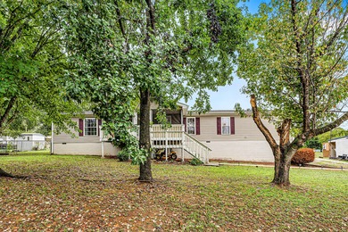 Nestled on nearly 1/2 acre, this beautifully maintained