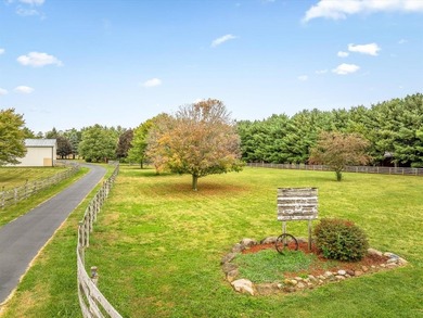 Presenting an exceptional 8+ acre estate zoned for agricultural