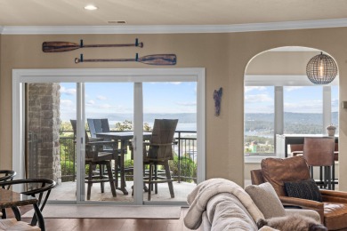 Step into low-maintenance living where the lake is your backdrop