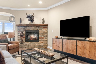 Step into low-maintenance living where the lake is your backdrop