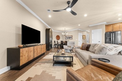 Step into low-maintenance living where the lake is your backdrop