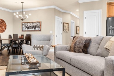 Step into low-maintenance living where the lake is your backdrop