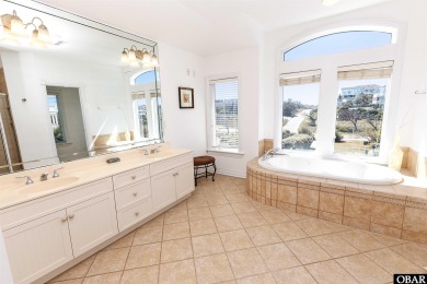 Exceptional oceanfront estate situated on half an acre with over