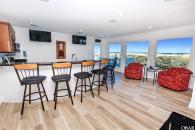 Exceptional oceanfront estate situated on half an acre with over