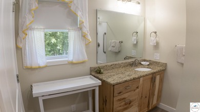 ABSOLUTELY STUNNING lake home right off of Hwy UU and just 3.4