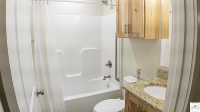 ABSOLUTELY STUNNING lake home right off of Hwy UU and just 3.4