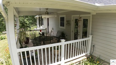 ABSOLUTELY STUNNING lake home right off of Hwy UU and just 3.4