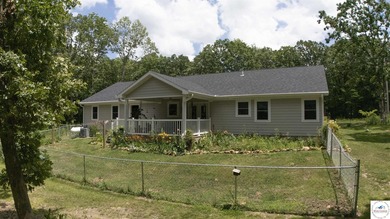 ABSOLUTELY STUNNING lake home right off of Hwy UU and just 3.4