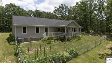 ABSOLUTELY STUNNING lake home right off of Hwy UU and just 3.4