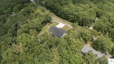 ABSOLUTELY STUNNING lake home right off of Hwy UU and just 3.4