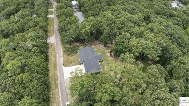 ABSOLUTELY STUNNING lake home right off of Hwy UU and just 3.4