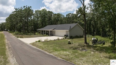 ABSOLUTELY STUNNING lake home right off of Hwy UU and just 3.4