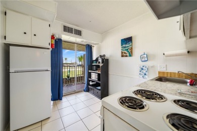 Fully furnished first floor corner condo that offers a compact