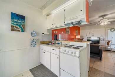 Fully furnished first floor corner condo that offers a compact