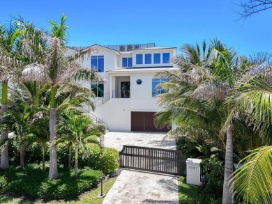 Ocean Ridge townhome, perched directly on the sand, showcases a