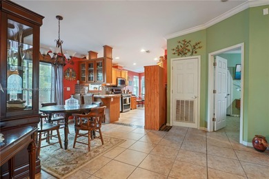 MOTIVATED SELLER! Nestled between lakes and lush greenery is