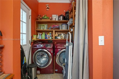 MOTIVATED SELLER! Nestled between lakes and lush greenery is