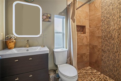 MOTIVATED SELLER! Nestled between lakes and lush greenery is