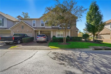 Second story condo with elevator. Covered balcony.  Large open