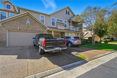 Second story condo with elevator. Covered balcony.  Large open