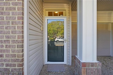 Second story condo with elevator. Covered balcony.  Large open