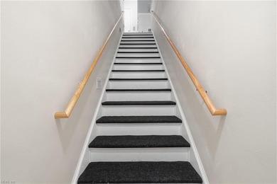 Second story condo with elevator. Covered balcony.  Large open