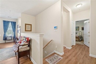 Second story condo with elevator. Covered balcony.  Large open