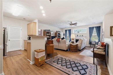 Second story condo with elevator. Covered balcony.  Large open